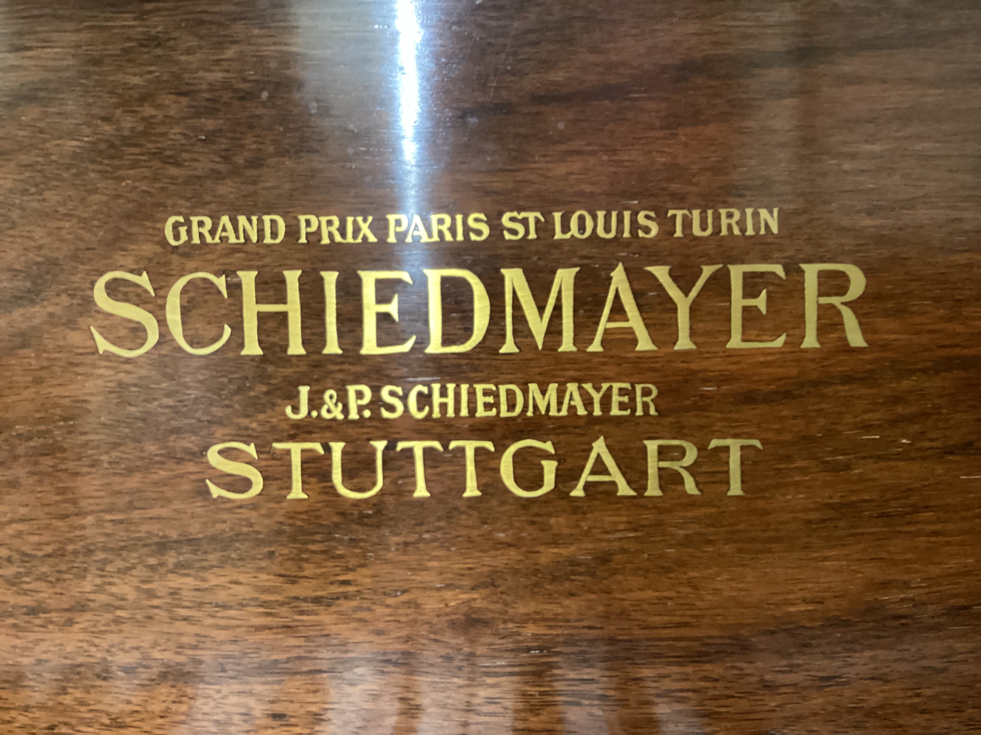 A Schiedmayer rosewood grand piano, circa 1935, length 194cm, width 152cm, height 99cm closed, together with a modern hinged box seat piano stool CITES Submission reference 2JRHUCGB